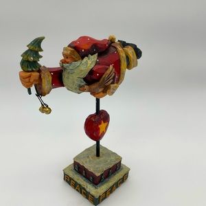 Adorable flying Santa holiday figurine.
